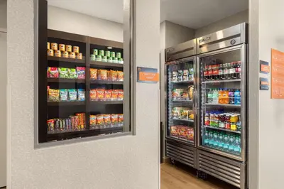 a refrigerator filled with lots of drinks in a store at La Quinta by Wyndham Santa Clarita - Valencia in Stevenson Ranch