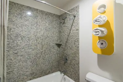 a bathroom with a shower and a white toilet at Motel 6-South El Monte, CA - Los Angeles in South El Monte