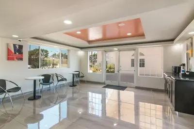 a kitchen with tables and chairs in a room at Motel 6-South El Monte, CA - Los Angeles in South El Monte