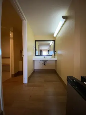 a bathroom with a sink and a mirror at Americas Best Value Inn - Azusa/Pasadena in Azusa
