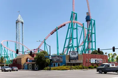 a roller coaster in a amusement park with cars at Travelodge by Wyndham Brea in Brea
