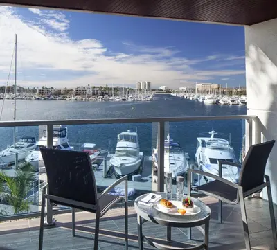 a balcony with a view of a marina with boats at Marina del Rey Hotel in Los Angeles