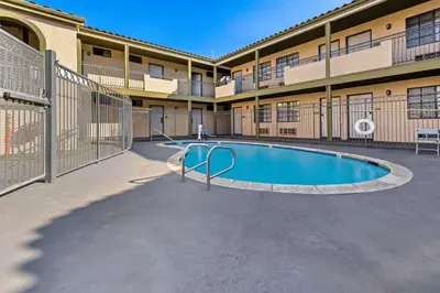 a swimming pool in front of a building at Rodeway Inn Santa Ana - Garden Grove in Santa Ana