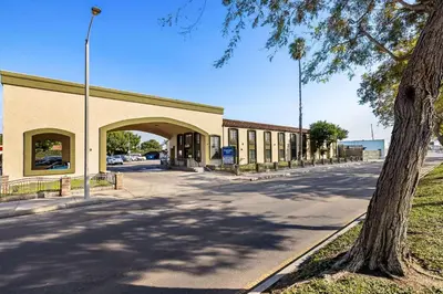 an empty street in front of a building at Rodeway Inn Santa Ana - Garden Grove in Santa Ana