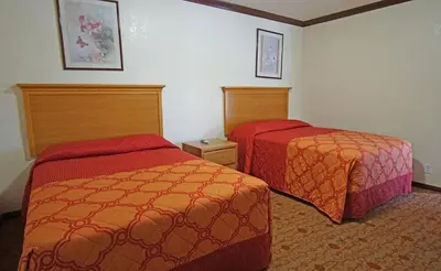 a hotel room with two beds in a room at Rosa Bell Motel - Los Angeles in Los Angeles