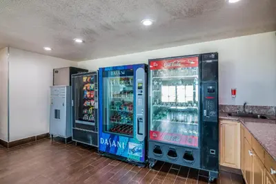two soda machines are in a kitchen next to a counter at Red Roof Inn Palmdale - Lancaster in Palmdale
