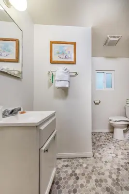 a bathroom with a sink and a toilet at Wilshire Motel in Los Angeles