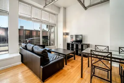 a living room with a couch and a table at AIR Venice on the Beach in Los Angeles