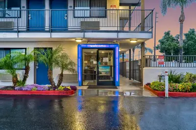 an entrance to a building with a blue door at Motel 6-El Monte, CA - Los Angeles in El Monte