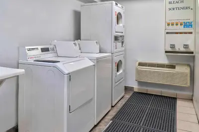 a laundry room with a washer and dryer at Motel 6-El Monte, CA - Los Angeles in El Monte