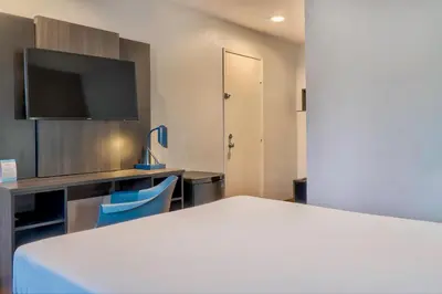 a hotel room with a bed and a tv at Motel 6-El Monte, CA - Los Angeles in El Monte