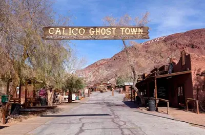 a sign that reads calico ghost town on a street at Economy Inn Barstow in Barstow
