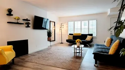 a living room with two couches and a fireplace at Double Suite Santa Monica - Free Parking in Santa Monica