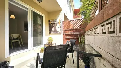 a small patio with a glass table and chairs at Double Suite Santa Monica - Free Parking in Santa Monica