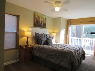 a bedroom with a bed and a ceiling fan at Big B's Den in Big Bear Lake