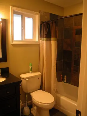 a bathroom with a white toilet and a shower at Big B's Den in Big Bear Lake