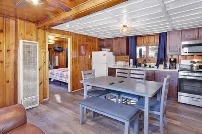 a kitchen with a table and chairs in a room at Lakeview Family Cabin by Big Bear Vacations in Big Bear Lake