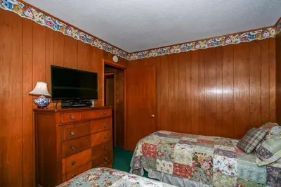 a bedroom with two beds and a television on a dresser at Avalon Hide Out-1336 by Big Bear Vacations in Big Bear Lake