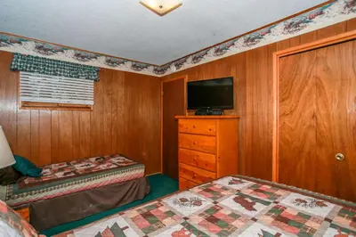 a small bedroom with two beds and a television at Avalon Hide Out-1336 by Big Bear Vacations in Big Bear Lake