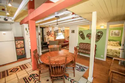 a kitchen and dining room with a table and chairs at Pines 23-1438 by Big Bear Vacations in Big Bear Lake