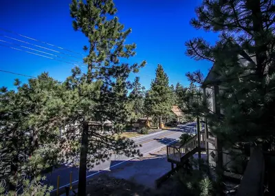 a view of a street with trees and a church at Life of Riley-1608 by Big Bear Vacations in Big Bear Lake
