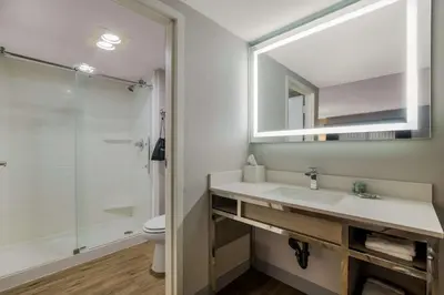 a bathroom with a sink and a mirror at Best Western Diamond Bar Hotel & Suites in Diamond Bar