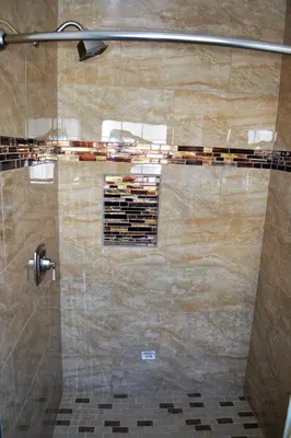 a shower in a bathroom with a glass door at Rex Motel in Ventura