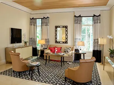 a living room with a couch and a table at Hotel Bel-Air - Dorchester Collection in Los Angeles