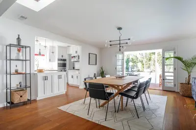 a kitchen and dining room with a table and chairs at Enchanting Sherman Oaks Home With Pool permit #HSR two five zero zero 3222 in Sherman Oaks