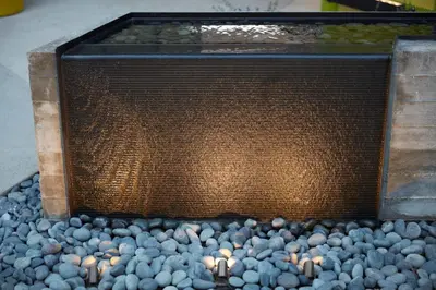 a bird bath with a bunch of birds in it at Mayumi in Los Angeles