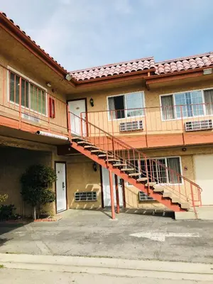 a building with a staircase on the side of it at norwalk inn & suites in Norwalk