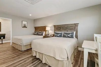 a bedroom with two beds and a piano at Big Bear Frontier in Big Bear Lake