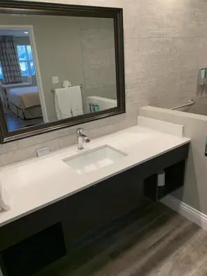 a bathroom with a sink and a mirror at Big Bear Frontier in Big Bear Lake