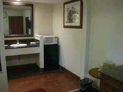 a bathroom with a sink and a mirror at Sunshine Motel in San Bernardino