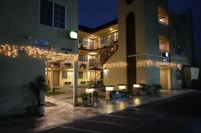 a building with lights on the side of it at Lambert Inn in Whittier