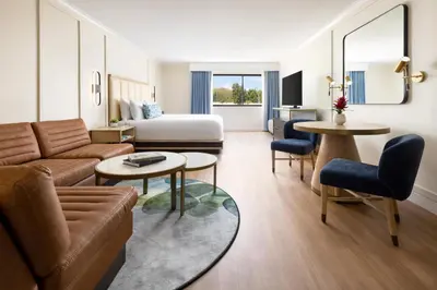 a living room with a couch and a bed at The Anza-a Calabasas Hotel in Calabasas