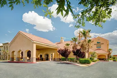 a hotel front of a building with a parking lot at Homewood Suites Lancaster in Lancaster