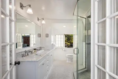 a bathroom with a sink and a toilet and a shower at The Charlie West Hollywood in Los Angeles