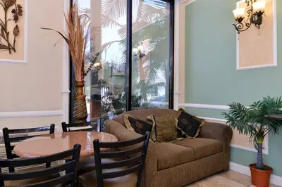 a living room with a couch and a table at Americas Best Value Inn Pasadena in Pasadena
