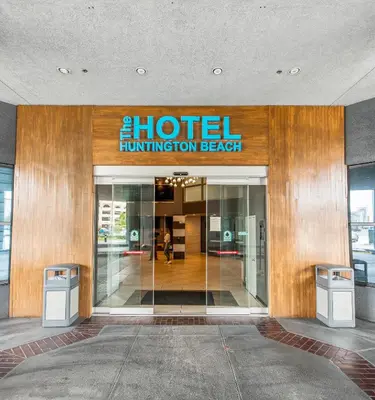 a hotel entrance with a hotel function breach sign on it at Hotel Huntington Beach in Huntington Beach