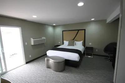 a hotel room with a bed and a window at Grandview Inn in Hermosa Beach