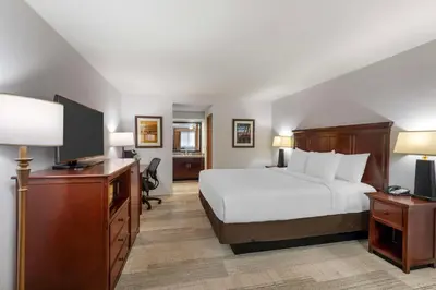 a hotel room with a bed and a flat screen tv at Best Western Plus Redondo Beach Inn in Redondo Beach
