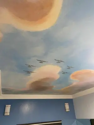 a painting of planes flying in the sky on a ceiling at Golden West Manor Motel in Los Angeles