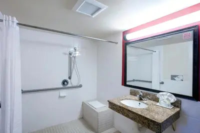 a bathroom with a sink and a mirror at The Hotel 39 in Westminster