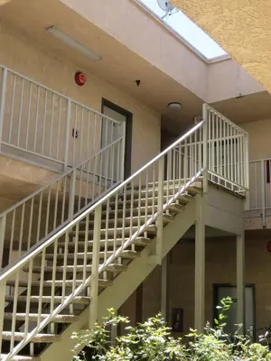 a white staircase on the side of a building at Mountain Inn in Ontario
