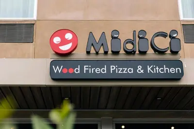a sign on the side of a building with a marica sign at Courtyard by Marriott Los Angeles LAX/Hawthorne in Hawthorne