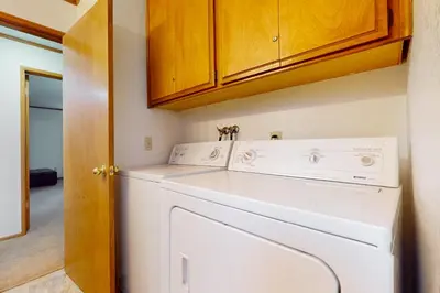 a white washer and dryer in a room at Victoria Court Vacation in Lake Arrowhead
