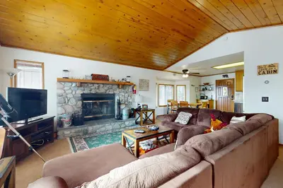 a living room with a couch and a fireplace at Victoria Court Vacation in Lake Arrowhead