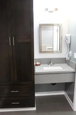 a bathroom with a sink and a mirror at Friendly Hills Inn - Whittier, Los Angeles in Whittier