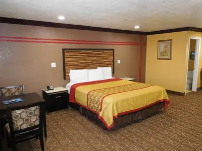 a hotel room with a large bed in a room at Diamond Inn in Inglewood